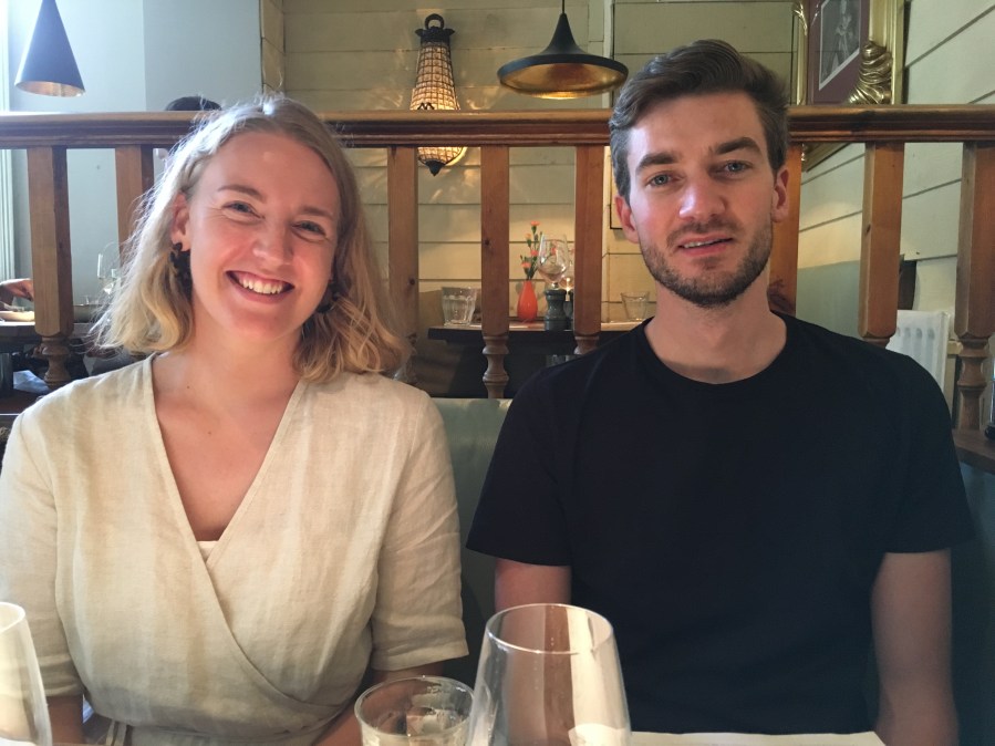 image of young lady with blonde hair and dark haired young man with a beard