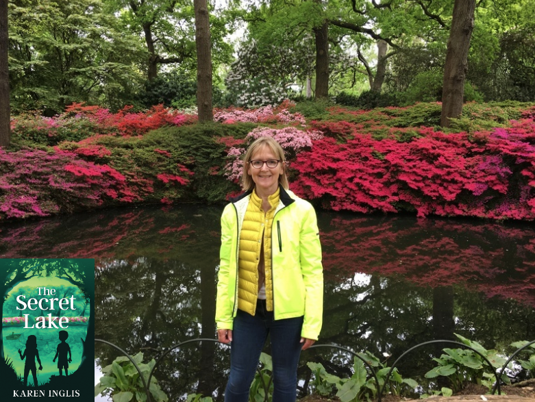 Image of Karen Inglis standing in front of Still Pond, Isabella Plantation with pink azaleas