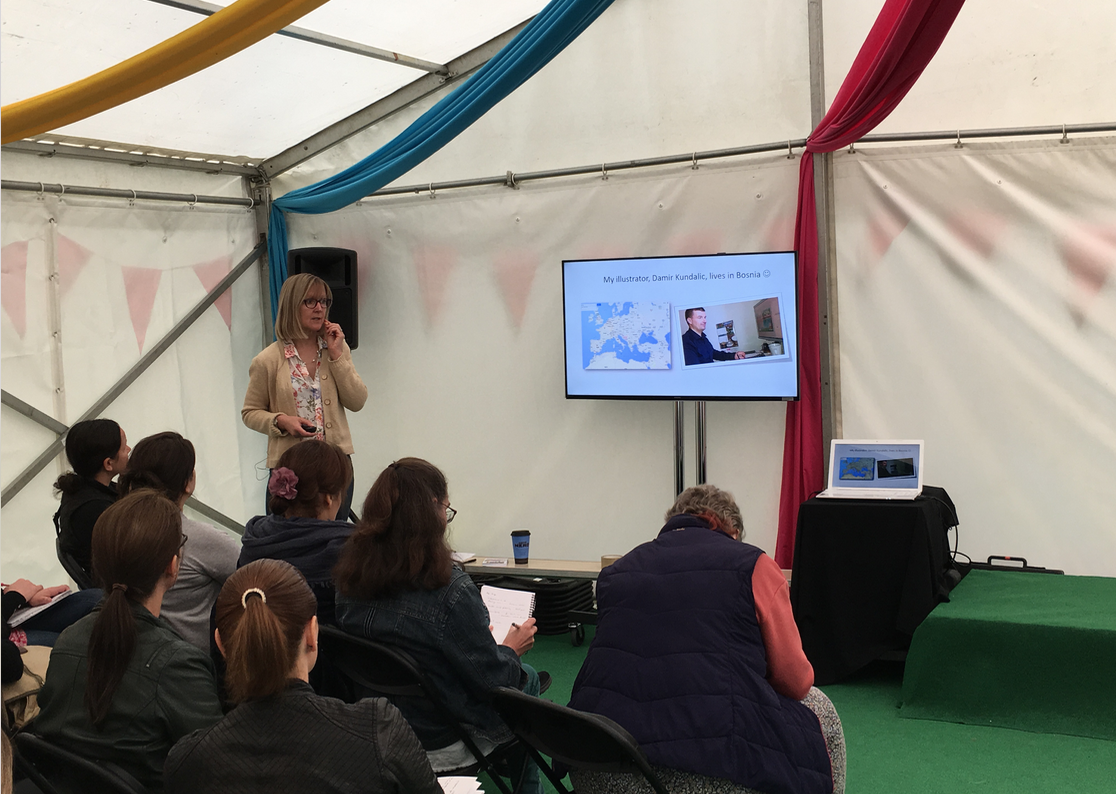 Karen Inglis giving a talk - audience and slides